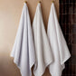 Catalina bath towels hanging on hooks, White Linen Gray