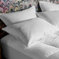 down pillows on bed, White