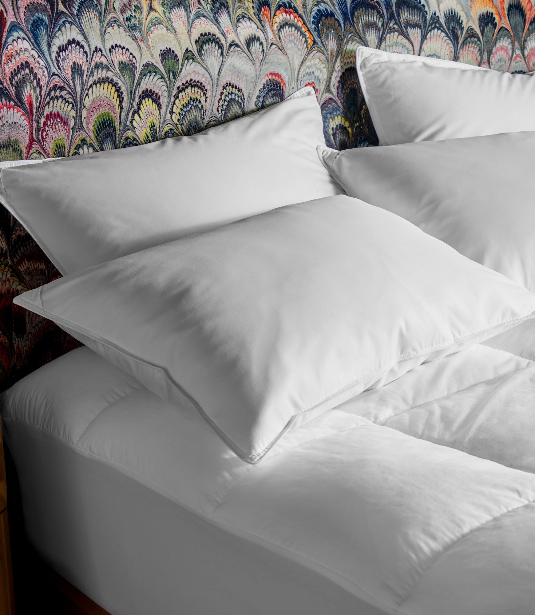 down pillows on bed, White