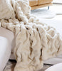 Faux fur blanket laying on couch, Pearl