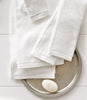 Jubilee bath towels folded on counter, White