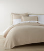 Mia Matelasse Coverlet on bed, Dune