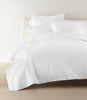 Montauk coverlet and shams on bed, White