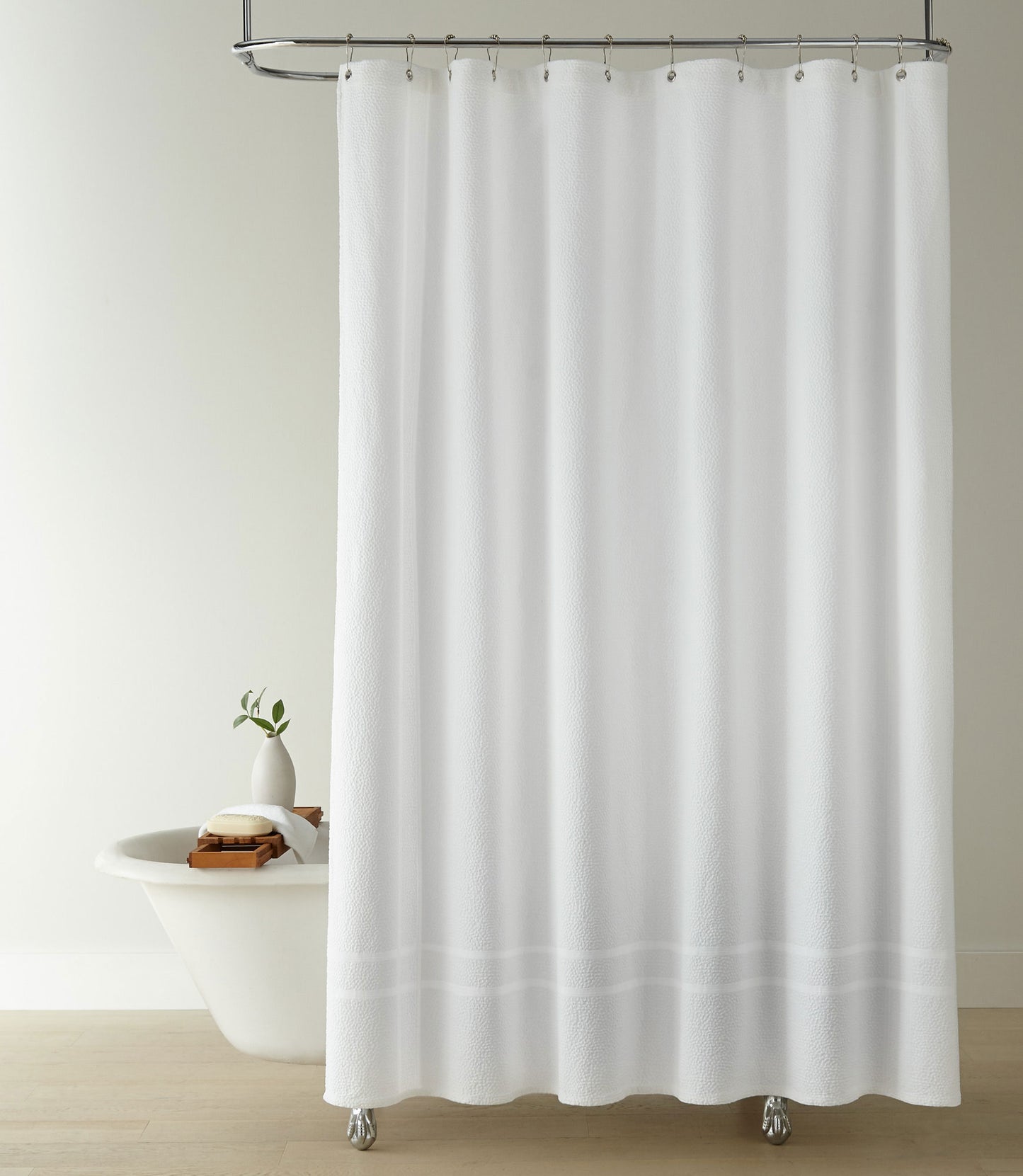 Montauk shower curtain hanging on track above shower tub, White