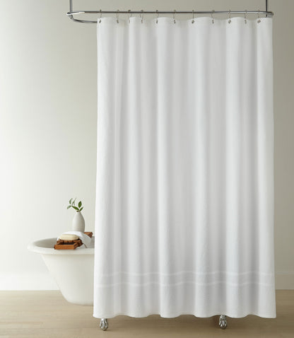 Montauk shower curtain hanging on track above shower tub, White