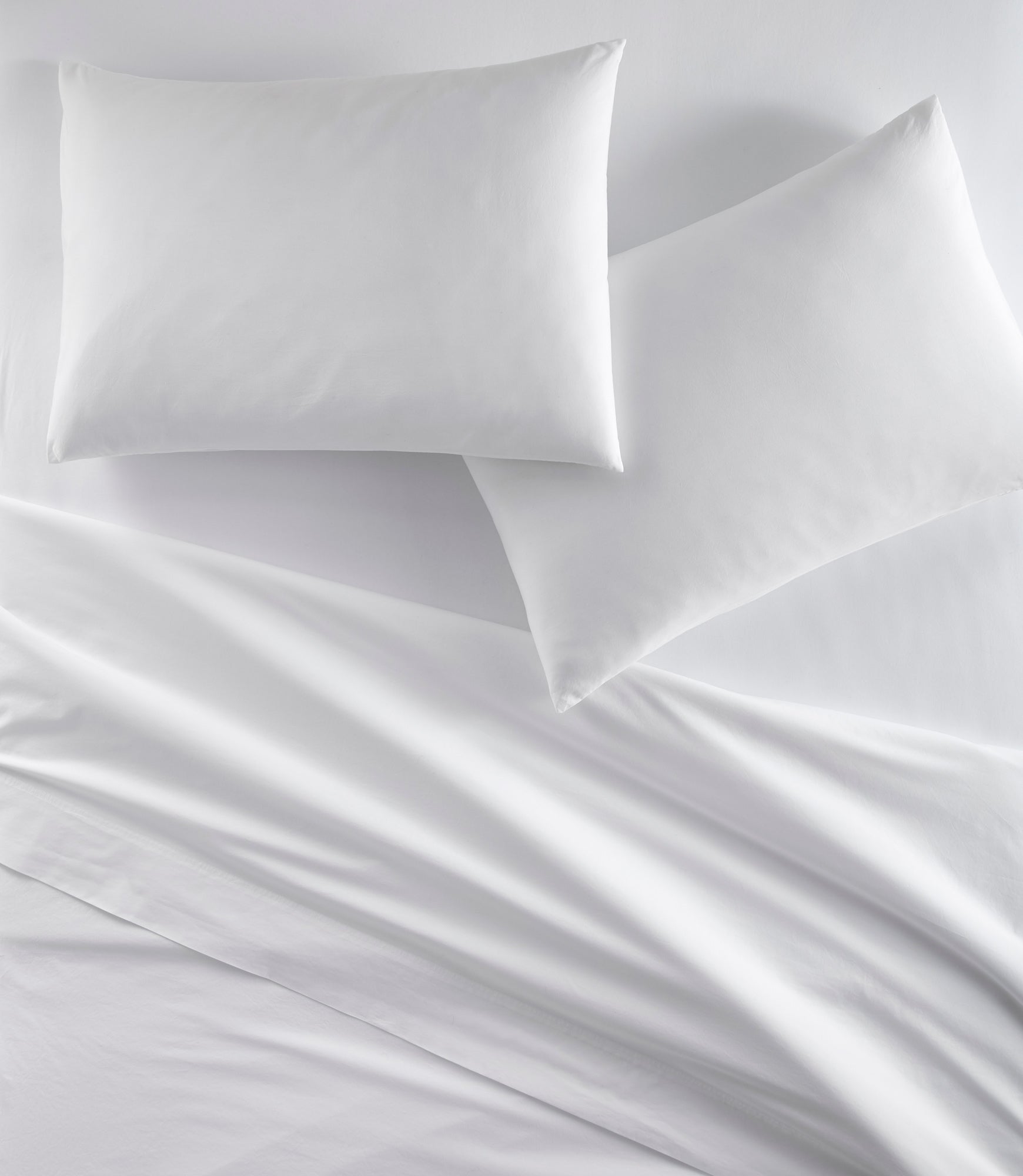 https://www.peacockalley.com/cdn/shop/products/40-winks-Percale-Sheets-White-1740x2000.jpg?v=1667006536&width=1946