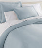 Angie Stonewashed Matelasse Sham on bed Smokey Blue