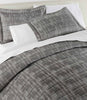 Biagio Jacquard Shams on bed Charcoal