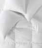 white goose down pillows and duvet on bed