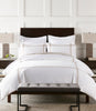 bed with striped shams and duvet cover Linen