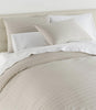 Houndstooth Percale Sleeping Shams Greige on bed