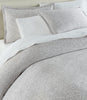 Ravenna Jacquard Shams on bed Light Gray