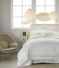 Soprano Trim Sateen Sham in Ivory on Bed